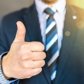 close-up-photo-of-man-wearing-black-suit-jacket-doing-thumbs-684385